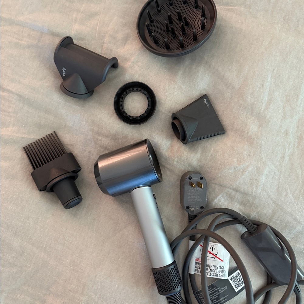 Dyson Hair Dryer with Multiple Dark Gray Attachments